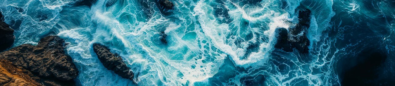 waves-hitting-rocky-shoreline-1280x280.jpg